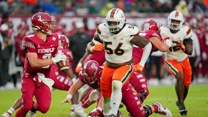 Sep 23, 2023; Philadelphia, Pennsylvania, USA;  Miami Hurricanes defensive lineman Leonard Taylor III (56) pursues Temple Owls quarterback E.J. Warner (3) in the second half against the Temple Owls at Lincoln Financial Field. 