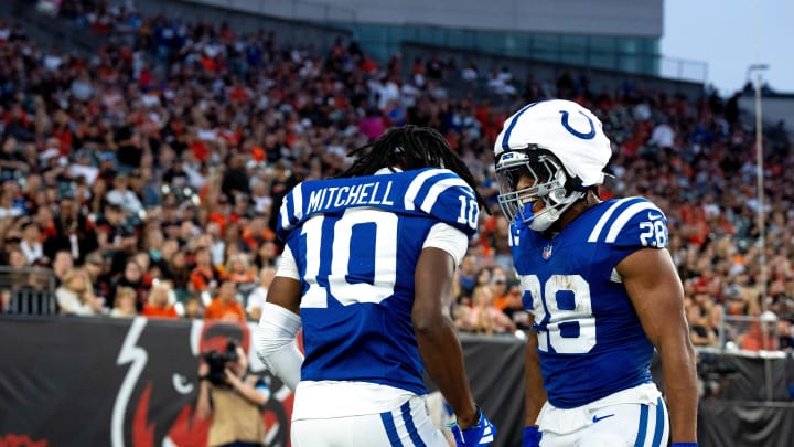 Indianapolis Colts running back Jonathan Taylor (28) and Indianapolis Colts wide receiver Adonai Mitchell (10) celebrate after scoring a touchdown in the first quarter between the Cincinnati Bengals and the Indianapolis Colts at Paycor Stadium in Cincinnati on Thursday, Aug. 22, 2024.