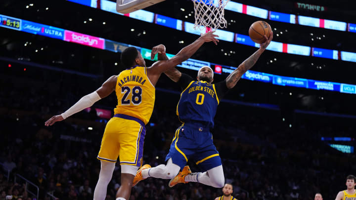 Apr 9, 2024; Los Angeles, California, USA; Golden State Warriors guard Gary Payton II (0) shoots the ball against Los Angeles Lakers forward Rui Hachimura (28) in the second half at Crypto.com Arena. Mandatory Credit: Kirby Lee-USA TODAY Sports