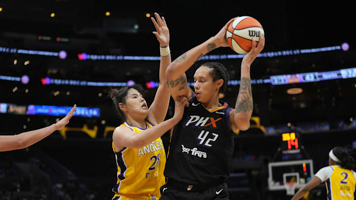 Sep 17, 2024; Los Angeles, California, USA; Phoenix Mercury center Brittney Griner (42) is defended by LA Sparks center Li Yueru (28) in the first half at Crypto.com Arena. Mandatory Credit: Kirby Lee-Imagn Images