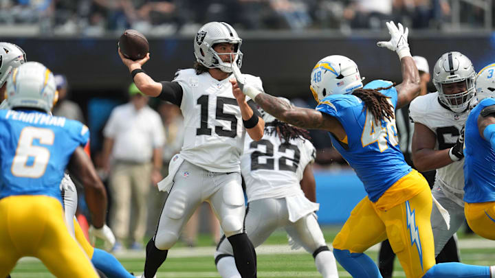 Sep 8, 2024; Inglewood, California, USA; Las Vegas Raiders quarterback Gardner Minshew (15) throws the ball against the Los Angeles Chargers in the first half at SoFi Stadium. Mandatory Credit: Kirby Lee-Imagn Images