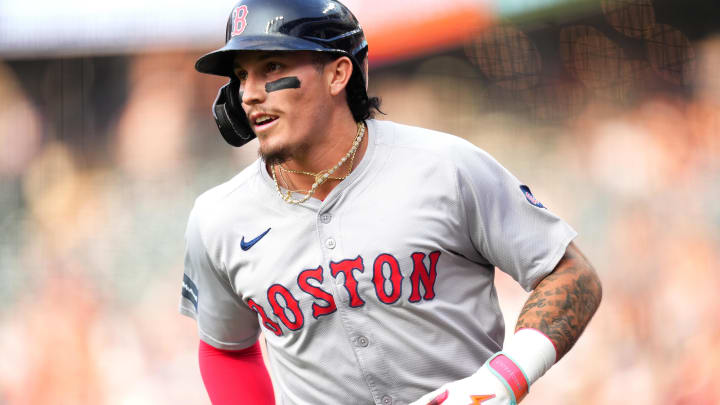 Jul 23, 2024; Denver, Colorado, USA; Boston Red Sox outfielder Jarren Duran (16) scores a run in the first inning against the Colorado Rockies at Coors Field.