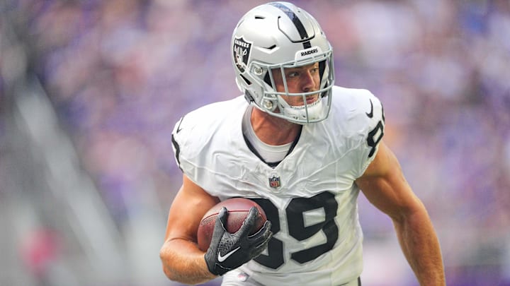 Aug 10, 2024; Minneapolis, Minnesota, USA; Las Vegas Raiders tight end Brock Bowers (89) runs after the catch against the Minnesota Vikings in the first quarter at U.S. Bank Stadium. Mandatory Credit: Brad Rempel-Imagn Images