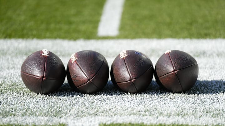 Four footballs before the Packers' 24–22 win over the Texans on Oct. 20, 2024.