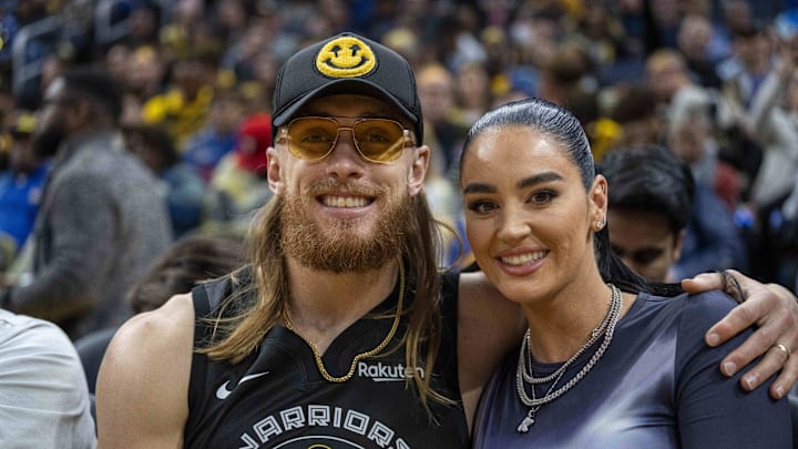 San Francisco 49ers tight end George Kittle and wife Claire Kittle at a game between Golden State Warriors and Philadelphia 76ers during the second quarter at Chase Center. 