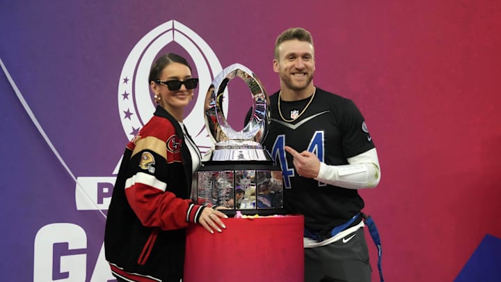 San Francisco 49ers fullback Kyle Juszczyk wife Kristin Juszcyk pose with trophy during the 2023 Pro Bowl.