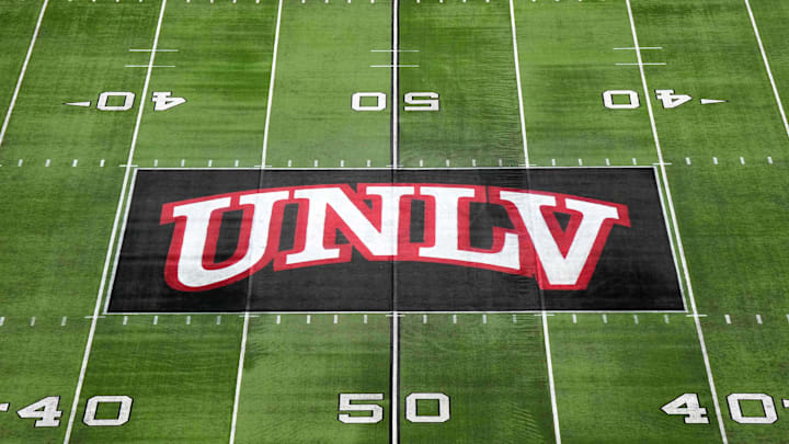The UNLV Rebels logo at midfield during the Mountain West Championship at Allegiant Stadium. The UNLV Rebels logo at midfield during the Mountain West Championship at Allegiant Stadium.