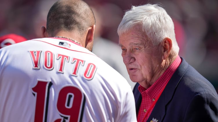 Injured Cincinnati Reds first baseman Joey Votto (19) talks with team owner Bob Castellini