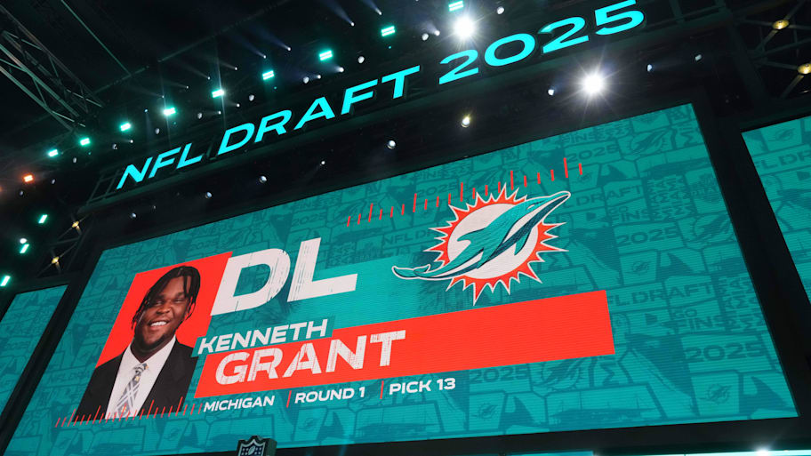 Michigan Wolverines defensive lineman Kenneth Grant is selected as the No. 13 pick by the Miami Dolphins during the NFL Draft at Lambeau Field.  | Kirby Lee-Imagn Images