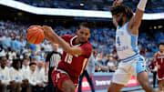 Dec 4, 2024; Chapel Hill, North Carolina, USA; Alabama Crimson Tide forward Jarin Stevenson (15) with the ball as North Carolina Tar Heels guard RJ Davis (4) defends in the first half at Dean E. Smith Center. Mandatory Credit: Bob Donnan-Imagn Images