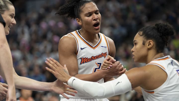 Sep 23, 2025; Minneapolis, Minnesota, USA; Phoenix Mercury forward Alyssa Thomas (25) celebrates with forward Satou Sabally (0) against the Minnesota Lynx in the second half during game two of the second round for the 2025 WNBA Playoffs at Target Center. Mandatory Credit: Jesse Johnson-Imagn Images