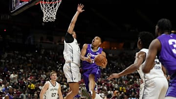Jul 14, 2025; Las Vegas, NV, USA;  Utah Jazz forward John Tonje (17) drives towards the basket against San Antonio Spurs forward Carter Bryant (11) during the first half of a NBA basketball game at the Thomas & Mack Center. Mandatory Credit: Lucas Peltier-Imagn Images