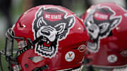 Dec 30, 2022; Charlotte, NC, USA; North Carolina State Wolfpack helmets during the first half against the Maryland Terrapins in the 2022 Duke's Mayo Bowl at Bank of America Stadium. Mandatory Credit: Jim Dedmon-Imagn Images