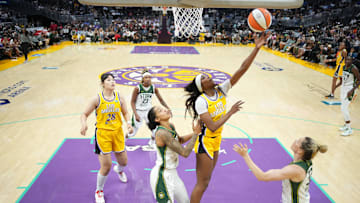 Sep 11, 2024; Los Angeles, California, USA: LA Sparks forward Rickea Jackson (2) shoots the ball against Seattle Storm forward Gabby Williams (5) and guard Sami Whitcomb (32) in the second half at Crypto.com Arena. Mandatory Credit: Kirby Lee-Imagn Images