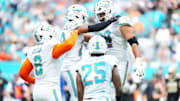 Miami Dolphins defensive tackle Zach Sieler (92) reacts with safety Minkah Fitzpatrick (29) after forcing a fumble against the New Orleans Saints during the first half at Hard Rock Stadium.