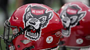 Dec 30, 2022; Charlotte, NC, USA; North Carolina State Wolfpack helmets during the first half against the Maryland Terrapins in the 2022 Duke's Mayo Bowl at Bank of America Stadium. Mandatory Credit: Jim Dedmon-Imagn Images