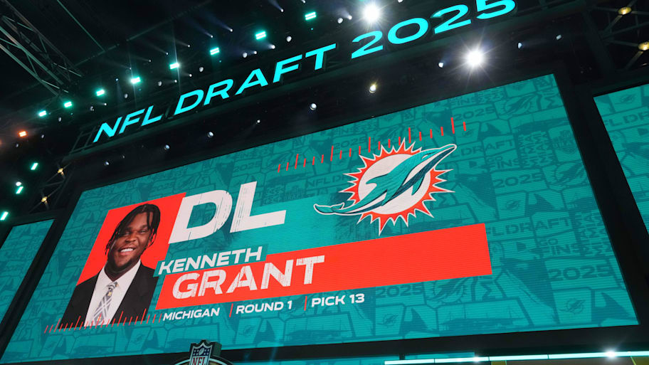 Michigan Wolverines defensive lineman Kenneth Grant is selected as the No. 13 pick by the Miami Dolphins during the NFL Draft at Lambeau Field. | Kirby Lee-Imagn Images