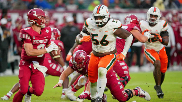 Sep 23, 2023; Philadelphia, Pennsylvania, USA;  Miami Hurricanes defensive lineman Leonard Taylor III (56) pursues Temple Owls quarterback E.J. Warner (3) in the second half against the Temple Owls at Lincoln Financial Field.