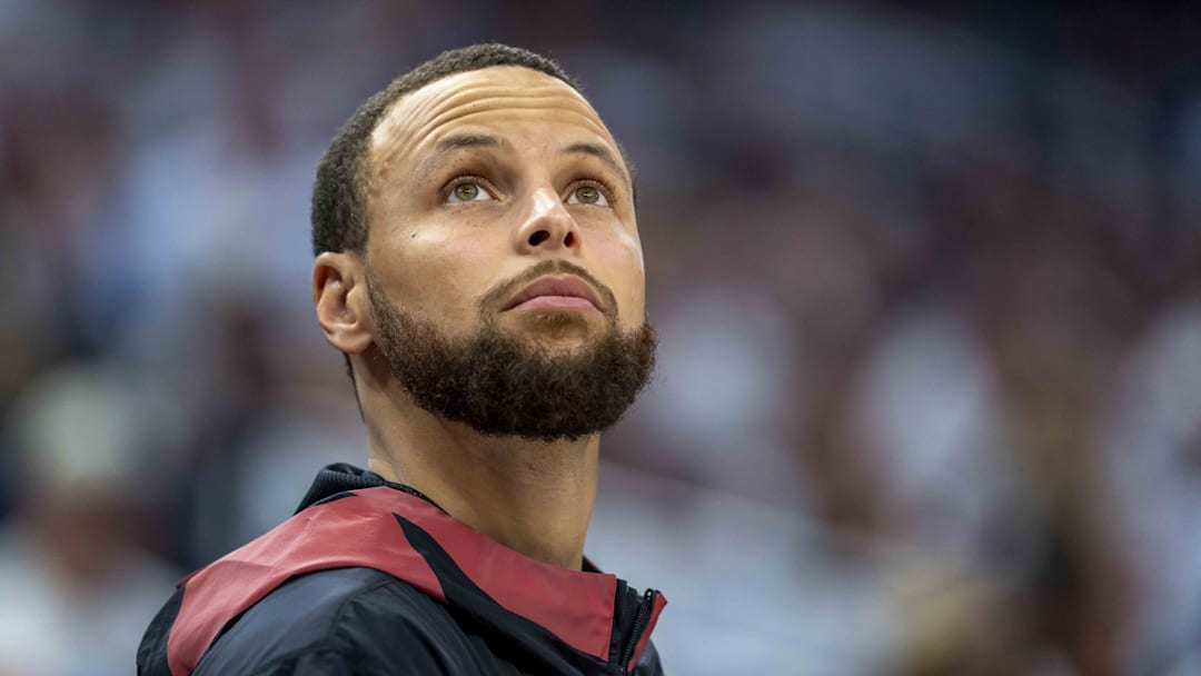 May 8, 2025; Minneapolis, Minnesota, USA; Golden State Warriors guard Stephen Curry (30) looks on from the bench against the Minnesota Timberwolves in the second half during game two of the second round for the 2025 NBA Playoffs at Target Center. Mandatory Credit: Jesse Johnson-Imagn Images