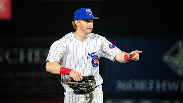 Owen Caissie in a blue and white pinstripe uniform.