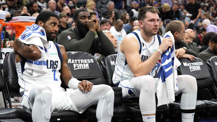 Dallas Mavericks guard Kyrie Irving (2) and guard Luka Doncic (right) sit on the bench during the third quarter against the Sacramento Kings at Golden 1 Center. 