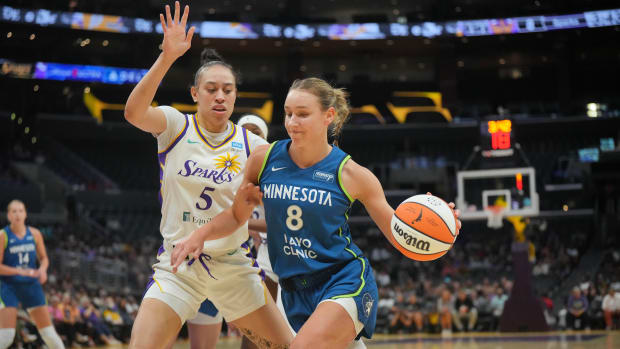 Minnesota Lynx forward Alanna Smith (8) dribbles the ball against LA Sparks forward Dearica Hamby