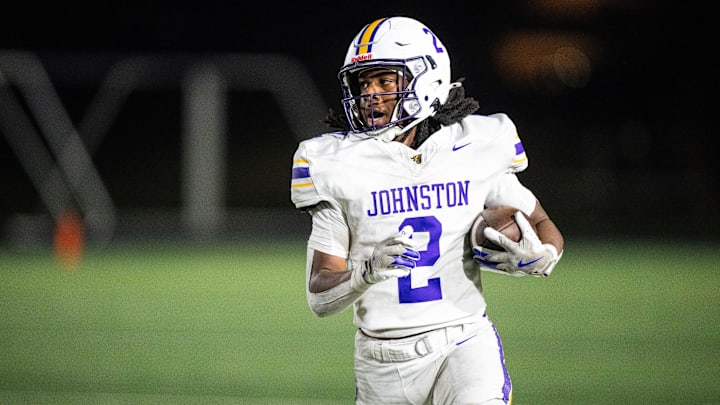 Johnston's Emri Jones (2) runs the ball against Ankeny on Oct. 3, 2025, at Ankeny Stadium.