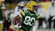 Green Bay Packers wide receiver Bo Melton (80) runs for the five yards during the second quarter of their game against the San Francisco 49ers Sunday, November 24, 2024 at Lambeau Field in Green Bay, Wisconsin.