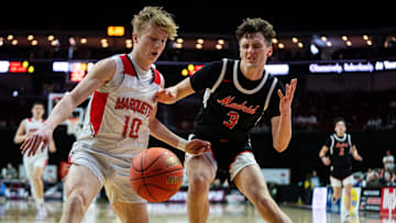 Bellevue Marquette's Eli Scott (10) and Madrid's Toryn Severson (3) chase after a loose ball in the Class 1A finals Friday night.