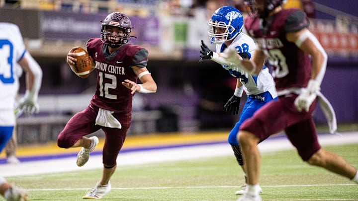 Grundy Center's Judd Jirovsky (12) keeps the ball as he runs the ball against Dike-New Hartford on Thursday, Nov. 21, 2024, at the UNI-Dome in Cedar Falls, IA.