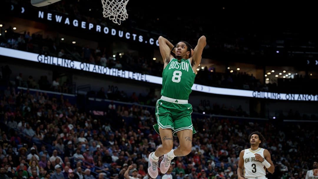 Oct 27, 2025; New Orleans, Louisiana, USA; Boston Celtics forward Josh Minott (8) goes up for a dunk against the New Orleans Pelicans during the first half at Smoothie King Center.