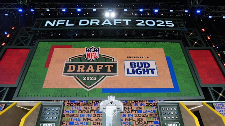 The Green Bay 2025 logo on the main stage before the NFL Draft at Lambeau Field. The Green Bay 2025 logo on the main stage before the NFL Draft at Lambeau Field.