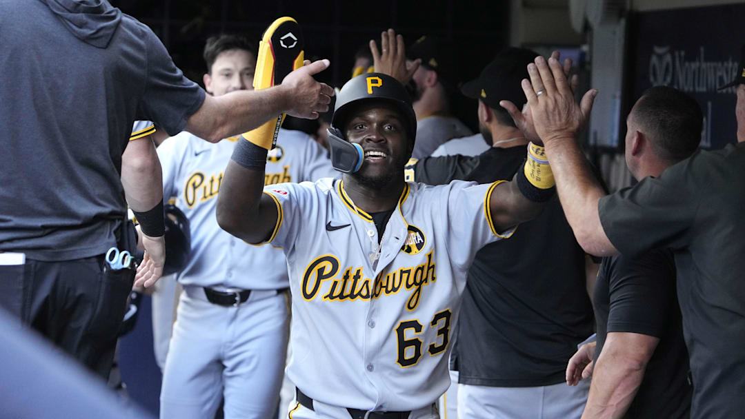 Aug 13, 2025; Milwaukee, Wisconsin, USA; Pittsburgh Pirates outfielder Ronny Simon (63) celebrates a home run by outfielder Bryan Reynolds against the Milwaukee Brewers in the sixth inning at American Family Field. Mandatory Credit: Michael McLoone-Imagn Images