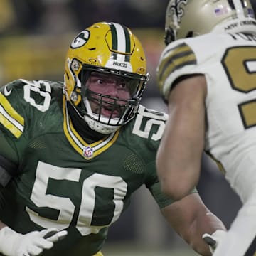 Green Bay Packers right tackle Zach Tom (50) blocks New Orleans Saints defensive end Payton Turner.