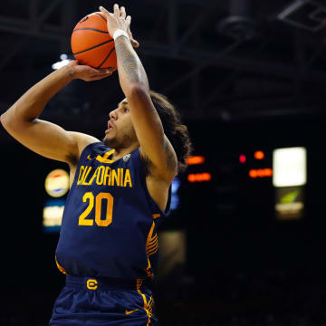 Feb 28, 2024; Boulder, Colorado, USA; California Golden Bears guard Jaylon Tyson (20) lines up a three point attempt in the first half against the Colorado Buffaloes at the CU Events Center.
