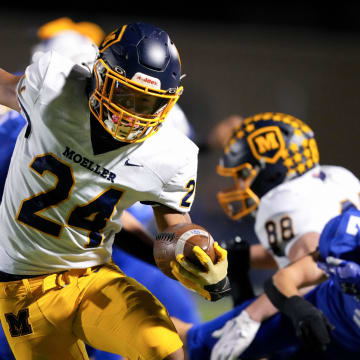Moeller Crusaders running back Jordan Marshall (24) tries to stay inbounds on a carry in the first half of a second-round Division I OHSAA high school football game, Friday, Nov. 3, 2023, at St. Xavier High School   s RDI Field in Cincinnati. The play was negated due to offensive holding.