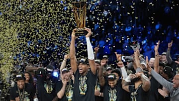 Dec 17, 2024; Las Vegas, Nevada, USA; Milwaukee Bucks forward Giannis Antetokounmpo (34) celebrates with the trophy and teammates after winning the Emirates NBA Cup championship game against the Oklahoma City Thunder at T-Mobile Arena. Mandatory Credit: Kyle Terada-Imagn Images