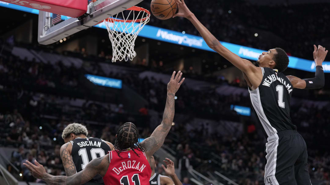 Dec 8, 2023; San Antonio, Texas, USA; San Antonio Spurs center Victor Wembanyama (1) blocks a shot by Chicago Bulls forward DeMar DeRozan (11) in the first quarter at the Frost Bank Center.