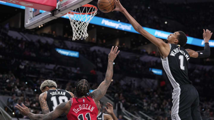 Dec 8, 2023; San Antonio, Texas, USA; San Antonio Spurs center Victor Wembanyama (1) blocks a shot by Chicago Bulls forward DeMar DeRozan (11) in the first quarter at the Frost Bank Center.