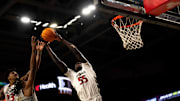 Cincinnati Bearcats forward Aziz Bandaogo (55) grabs a rebound over Alabama State Hornets guard Jalen Keago (10) in the first half of the NCAA basketball game at Fifth Third Arena in Cincinnati on Wednesday, Nov. 27, 2024.