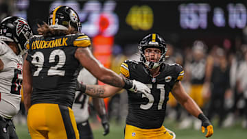 Nick Herbig (51) reacts with defensive tackle Isaiahh Loudermilk (92) 