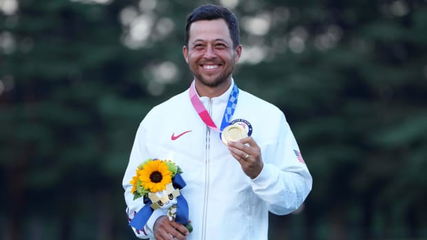 Xander Schauffele celebrates after winning the gold medal at the Tokyo Olympics. 