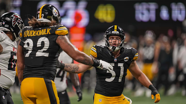 Nick Herbig (51) reacts with defensive tackle Isaiahh Loudermilk (92) 