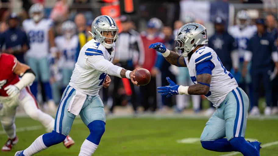 Oct 27, 2024; Santa Clara, California, USA; Dallas Cowboys quarterback Dak Prescott (4) hands off to Dallas Cowboys running back Ezekiel Elliott (15) against the San Francisco 49ers during the first quarter at Levi's Stadium. Mandatory Credit: Neville E. Guard-Imagn Images | Neville E. Guard-Imagn Images