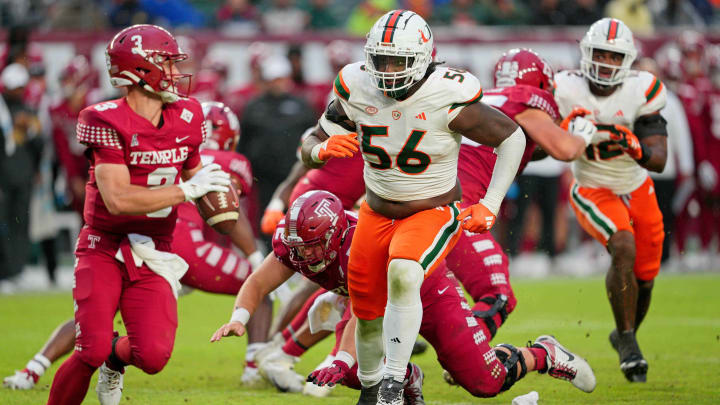 Sep 23, 2023; Philadelphia, Pennsylvania, USA;  Miami Hurricanes defensive lineman Leonard Taylor III (56) pursues Temple Owls quarterback E.J. Warner (3) in the second half against the Temple Owls at Lincoln Financial Field. Mandatory Credit: Andy Lewis-USA TODAY Sports