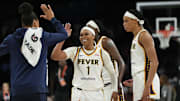 Sep 21, 2025; Las Vegas, Nevada, USA; Indiana Fever guard Odyssey Sims (1) celebrates with teammates during the third quarter in game one of the second round for the 2025 WNBA Playoffs against the Las Vegas Aces at Michelob Ultra Arena. Mandatory Credit: Lucas Peltier-Imagn Images