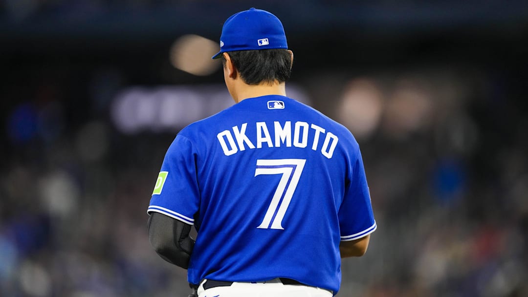 View of the back of Toronto Blue Jays third baseman Kazuma Okamoto's (7) jersey. 