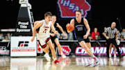 Waukee Northwest's Landon Davis (30) drives down the court on Wednesday, March 12, 2025, at Wells Fargo Arena.