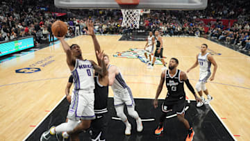 Feb 24, 2023; Los Angeles, California, USA; Sacramento Kings guard Malik Monk (0) shoots the ball against the LA Clippersin the second half at Crypto.com Arena. The Kings defeated the Clippers 176-175 in double overtime. Mandatory Credit: Kirby Lee-Imagn Images
