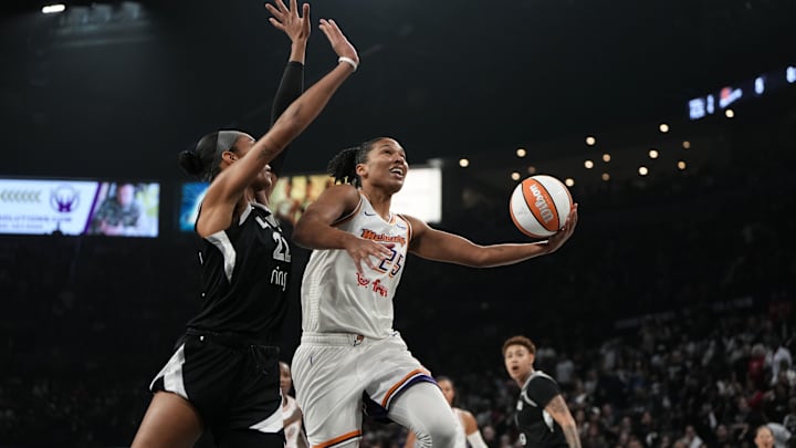 Oct 5, 2025; Las Vegas, Nevada, USA; Phoenix Mercury forward Alyssa Thomas (25) shoots a layup against Las Vegas Aces center A'ja Wilson (22) during the first quarter of game two of the 2025 WNBA Finals at Michelob Ultra Arena. Mandatory Credit: Lucas Peltier-Imagn Images Oct 5, 2025; Las Vegas, Nevada, USA; Phoenix Mercury forward Alyssa Thomas (25) shoots a layup against Las Vegas Aces center A'ja Wilson (22) during the first quarter of game two of the 2025 WNBA Finals at Michelob Ultra Arena. Mandatory Credit: Lucas Peltier-Imagn Images